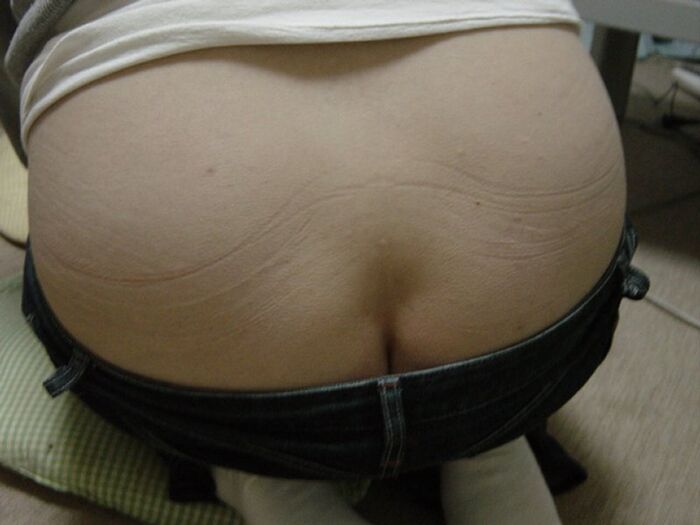 Erotic image of a sitting girl's buttocks 8th image